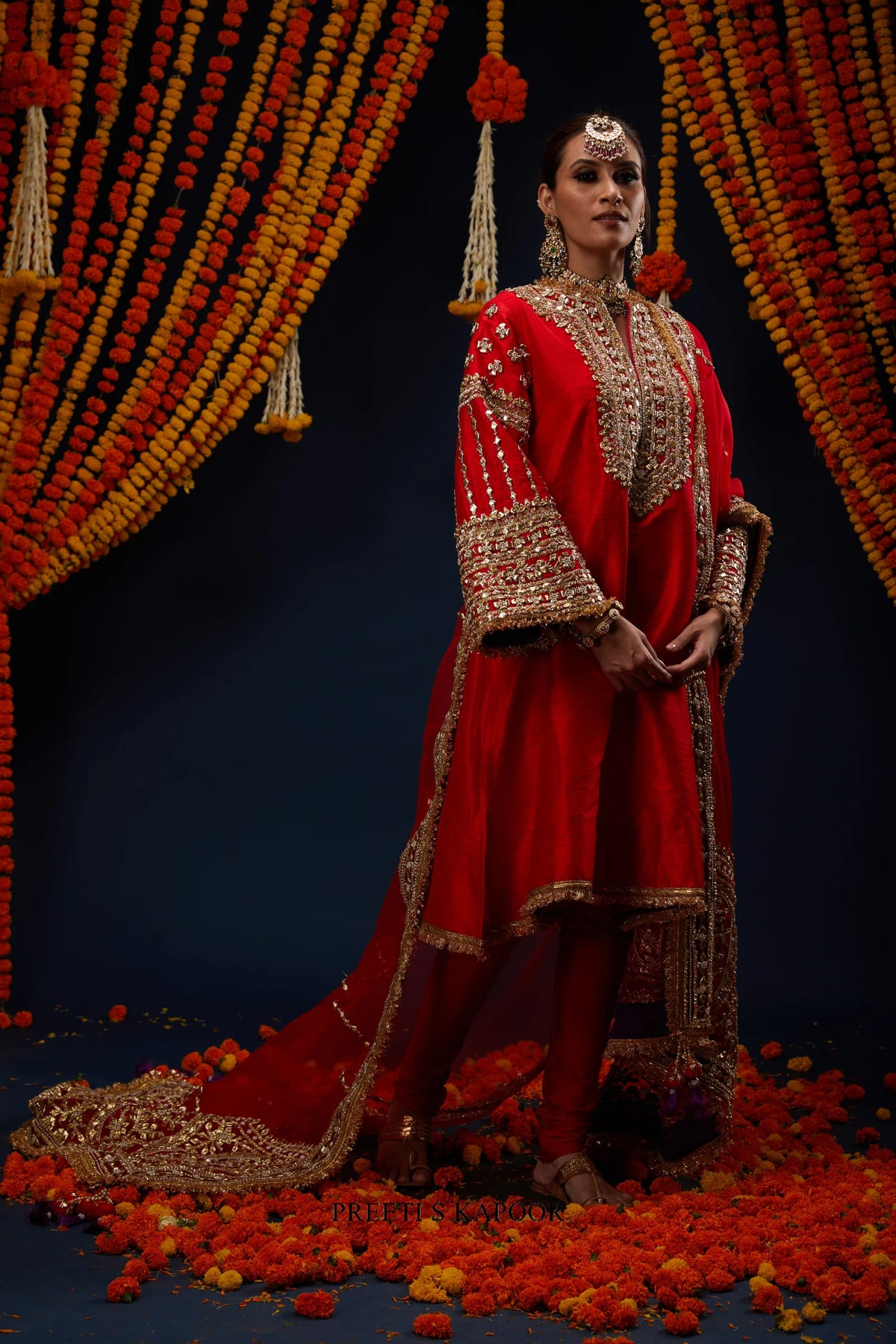 Woman wearing Red raw silk kurta with gold embroidery and trailing dupatta – Preeti S Kapoor