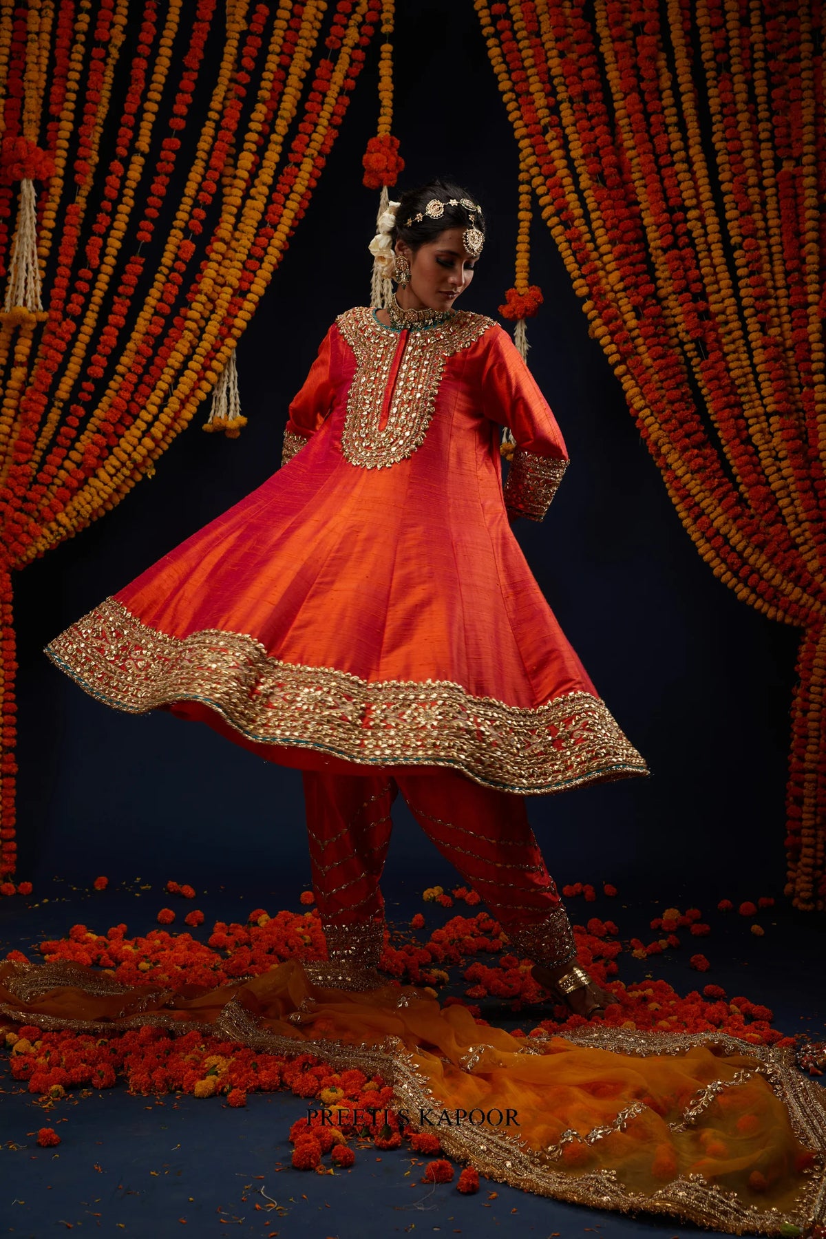 Woman twirling in Rust Red gold embroidered Anarkali salwar set – Preeti S Kapoor