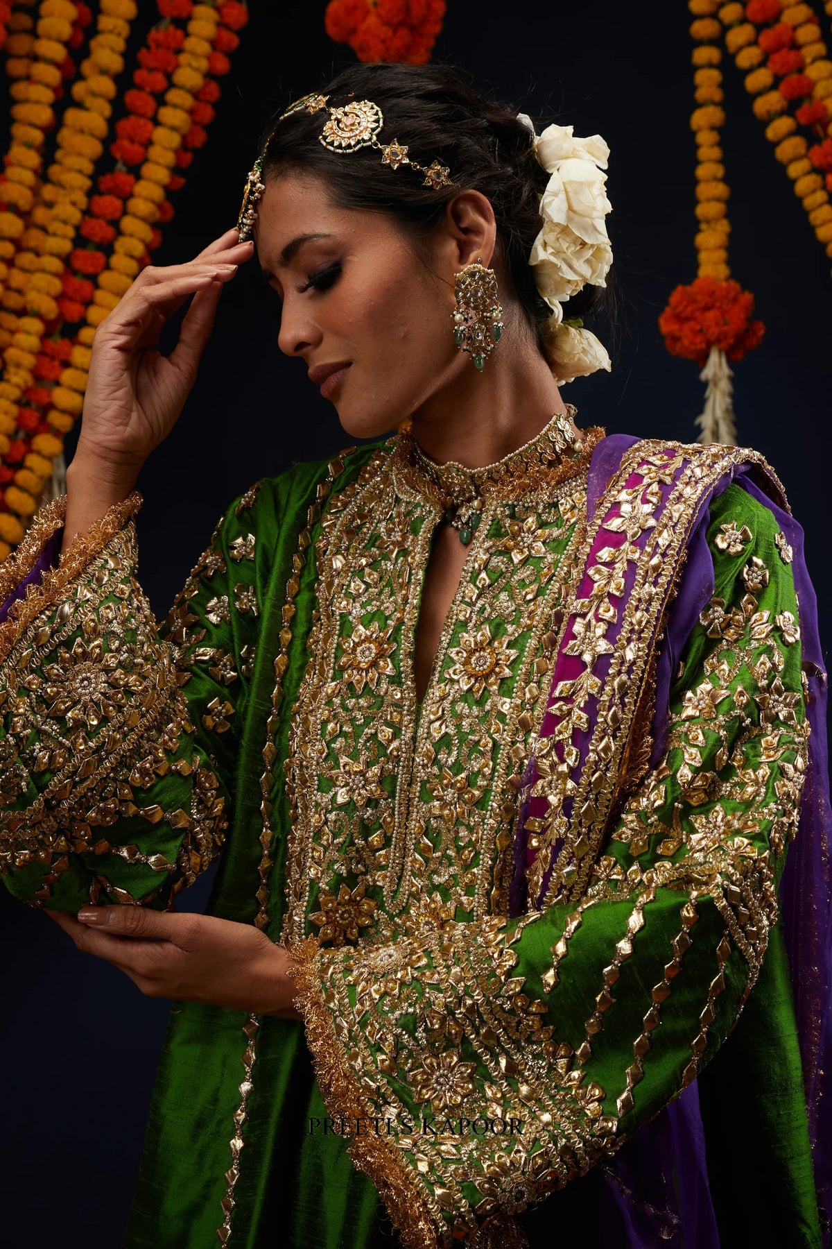Close-up of green raw silk kurta with dense gold Gota and Kundan embroidered sleeve – Preeti S Kapoor