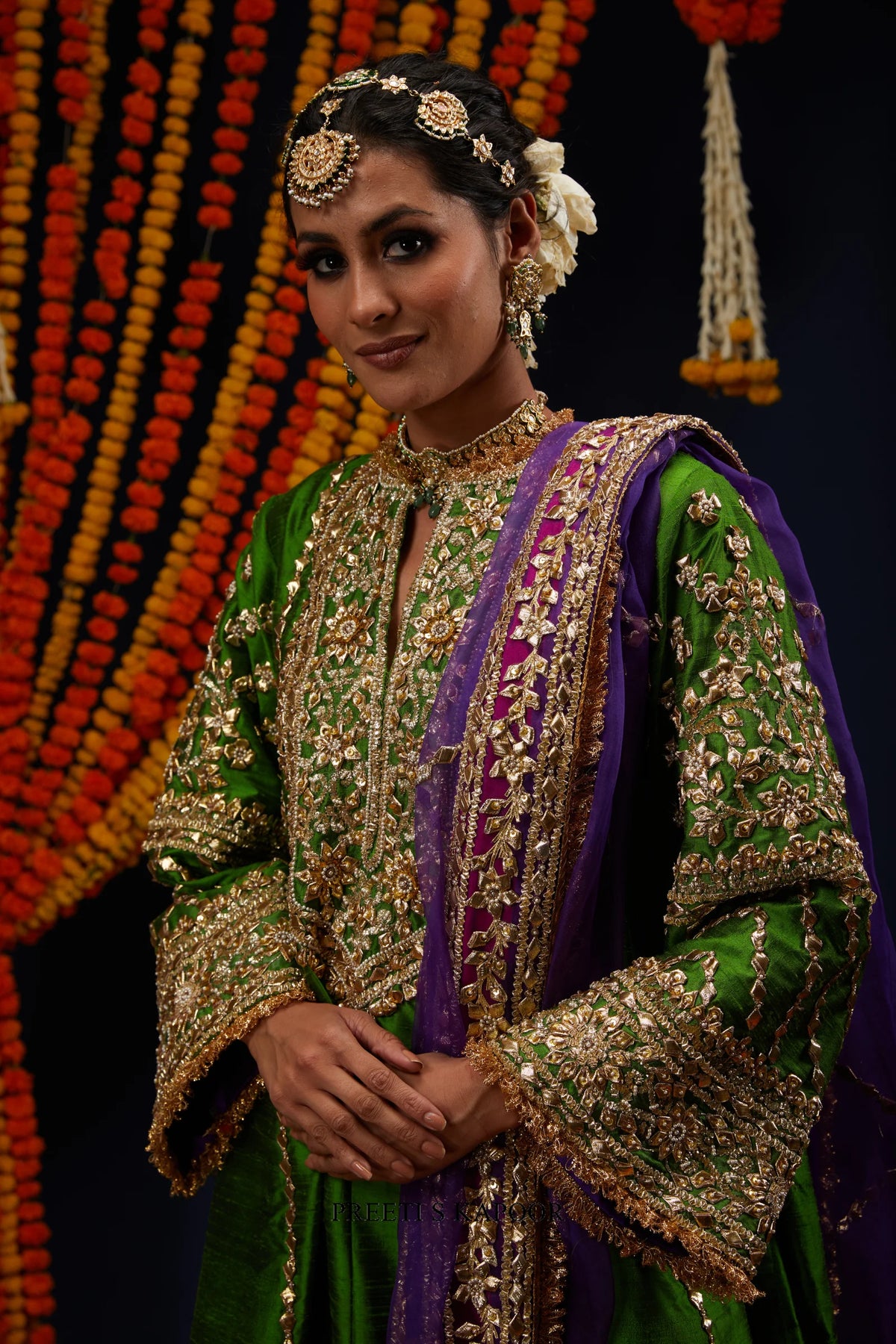 Close-up of green raw silk kurta V-shaped neckline with gold embroidered yoke – Preeti S Kapoor