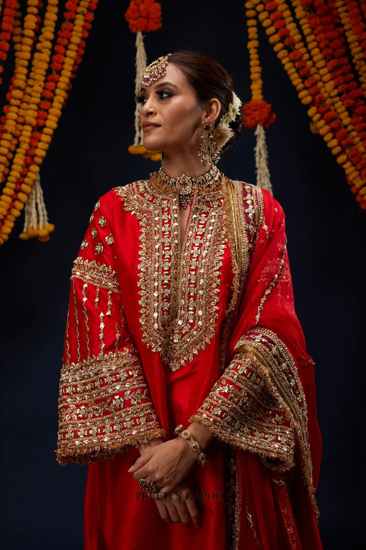 Close-up of Red kurta gold embroidered neckline and bell sleeve – Preeti S Kapoor