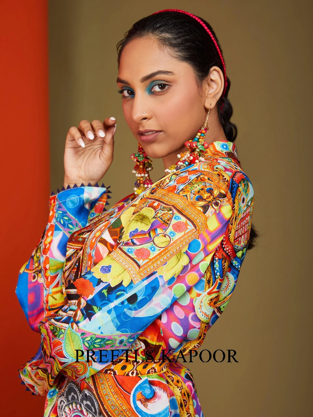 Close-up of Multicolor printed wrap jacket sleeve with zigzag picot trim – Preeti S Kapoor