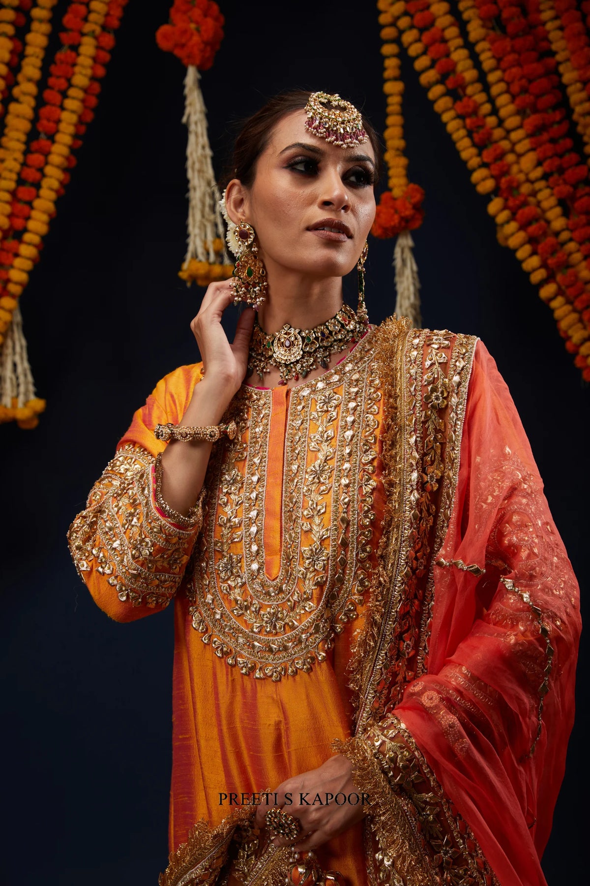 Close-up of Marigold Orange kurta gold embroidered round neckline – Preeti S Kapoor