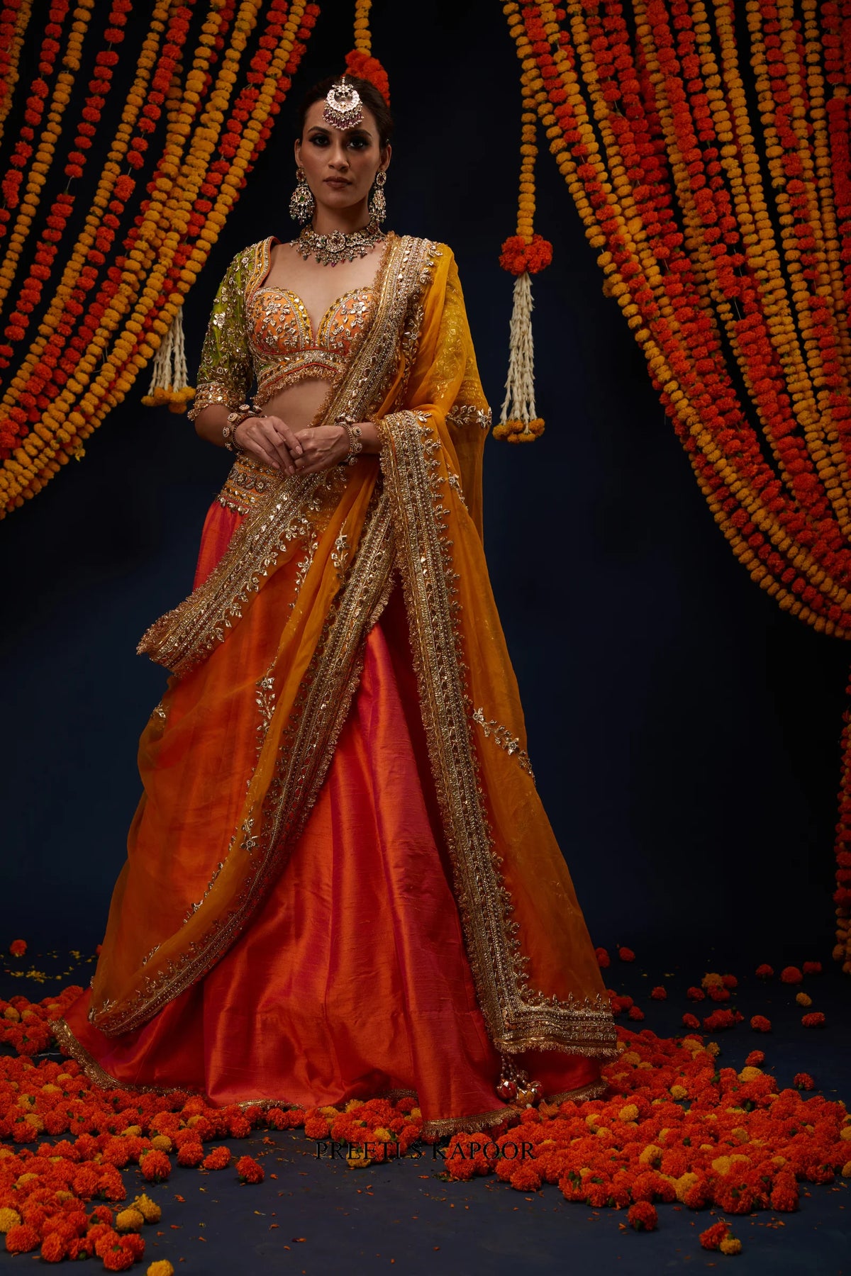 Woman wearing Rust Orange raw silk lehenga blouse with Marigold Yellow dupatta – Preeti S Kapoor