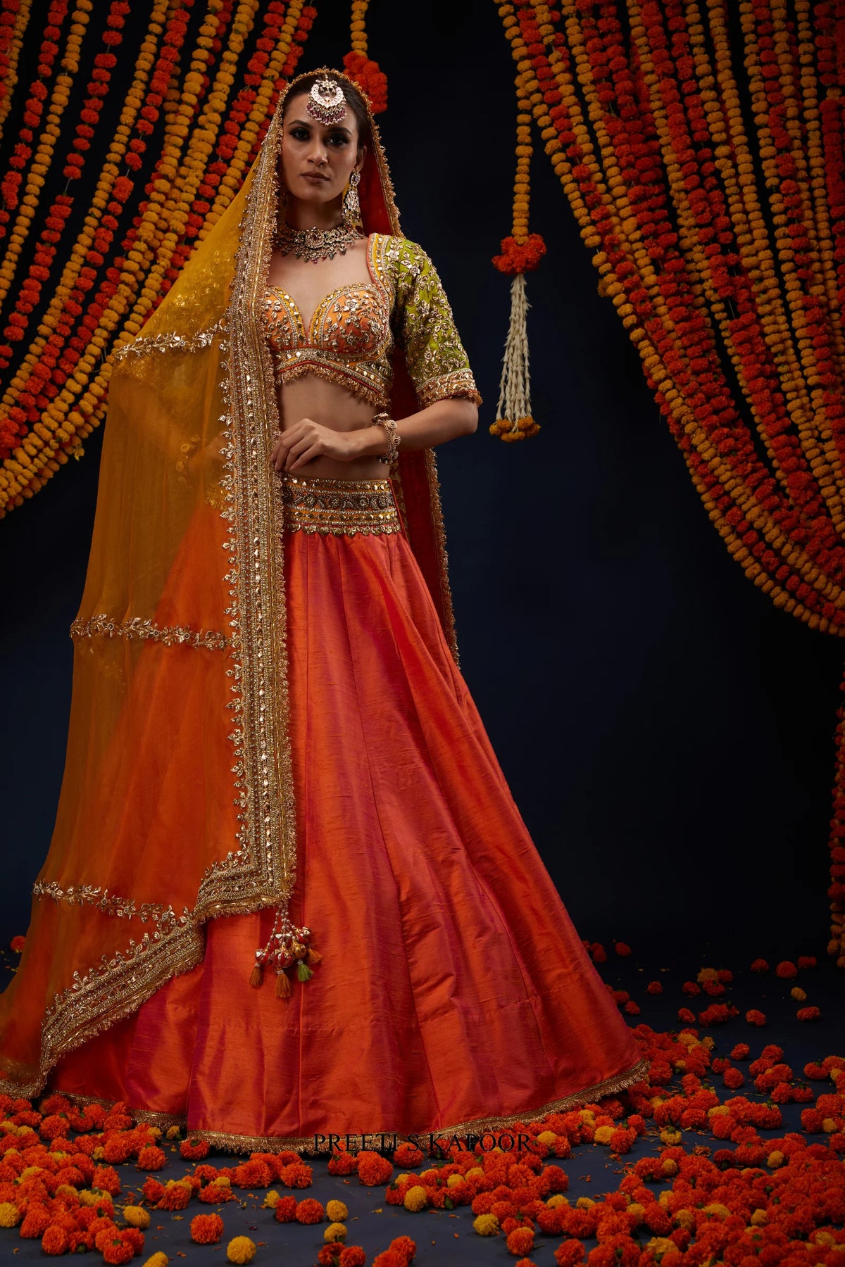 Rust Orange lehenga blouse styled with Marigold Yellow organza dupatta – Preeti S Kapoor