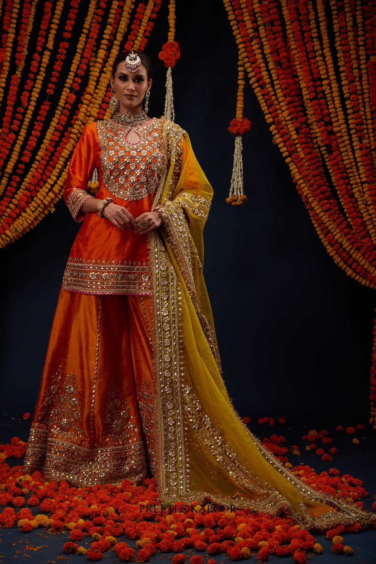 Woman wearing Orange raw silk kurta sharara with Mustard dupatta – Preeti S Kapoor