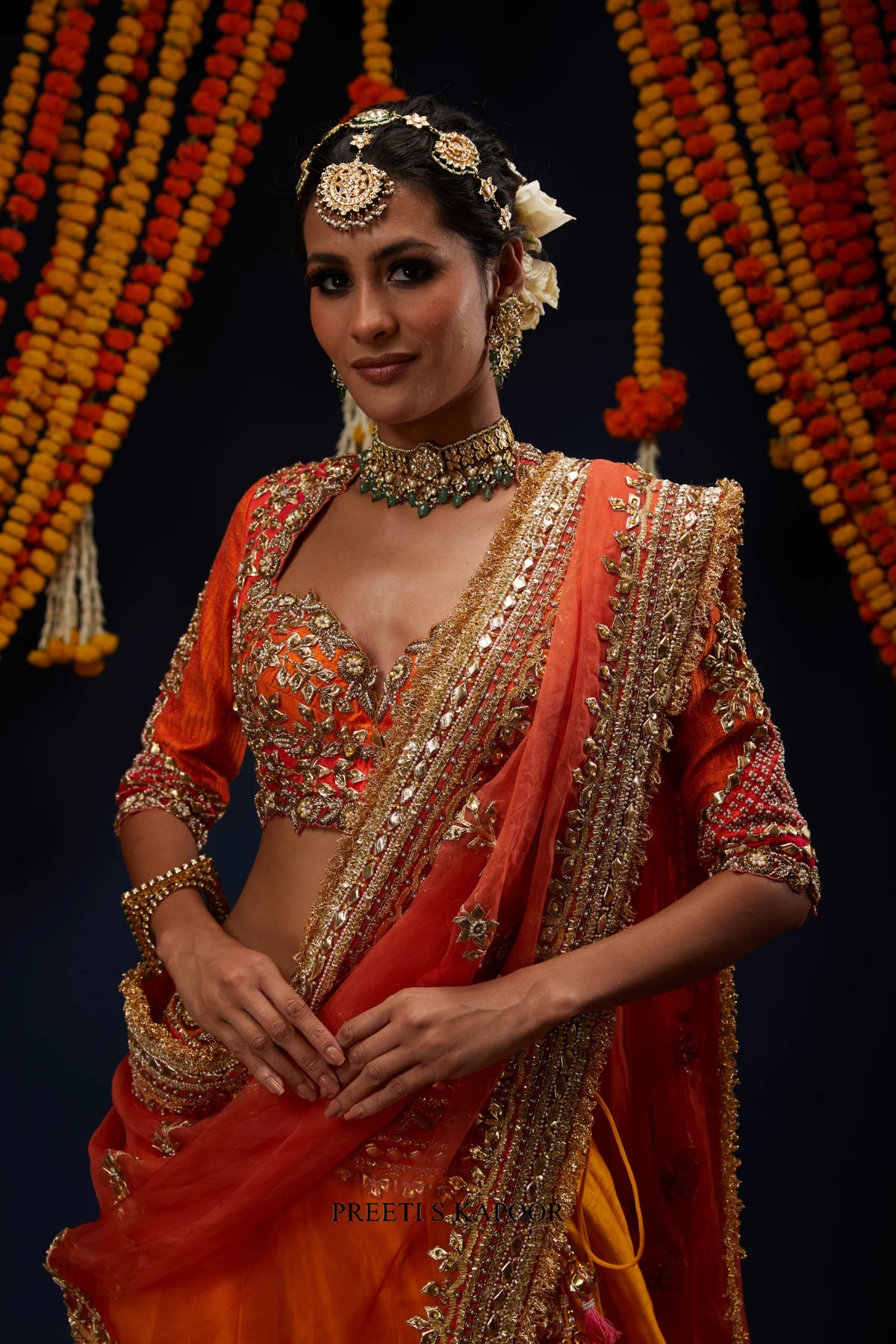 Close-up of Rust Red ombre embroidered blouse with layered necklace – Preeti S Kapoor