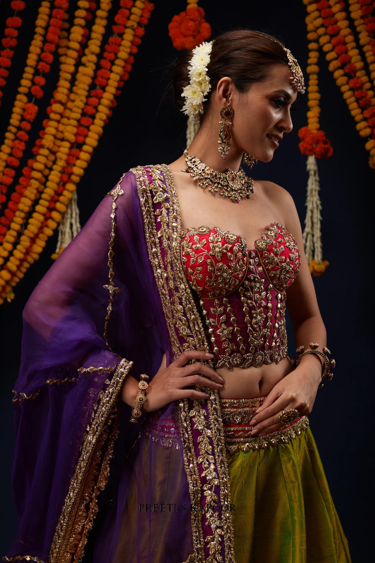 Close-up of Fuchsia Pink bustier blouse with gota embroidery and layered necklace – Preeti S Kapoor