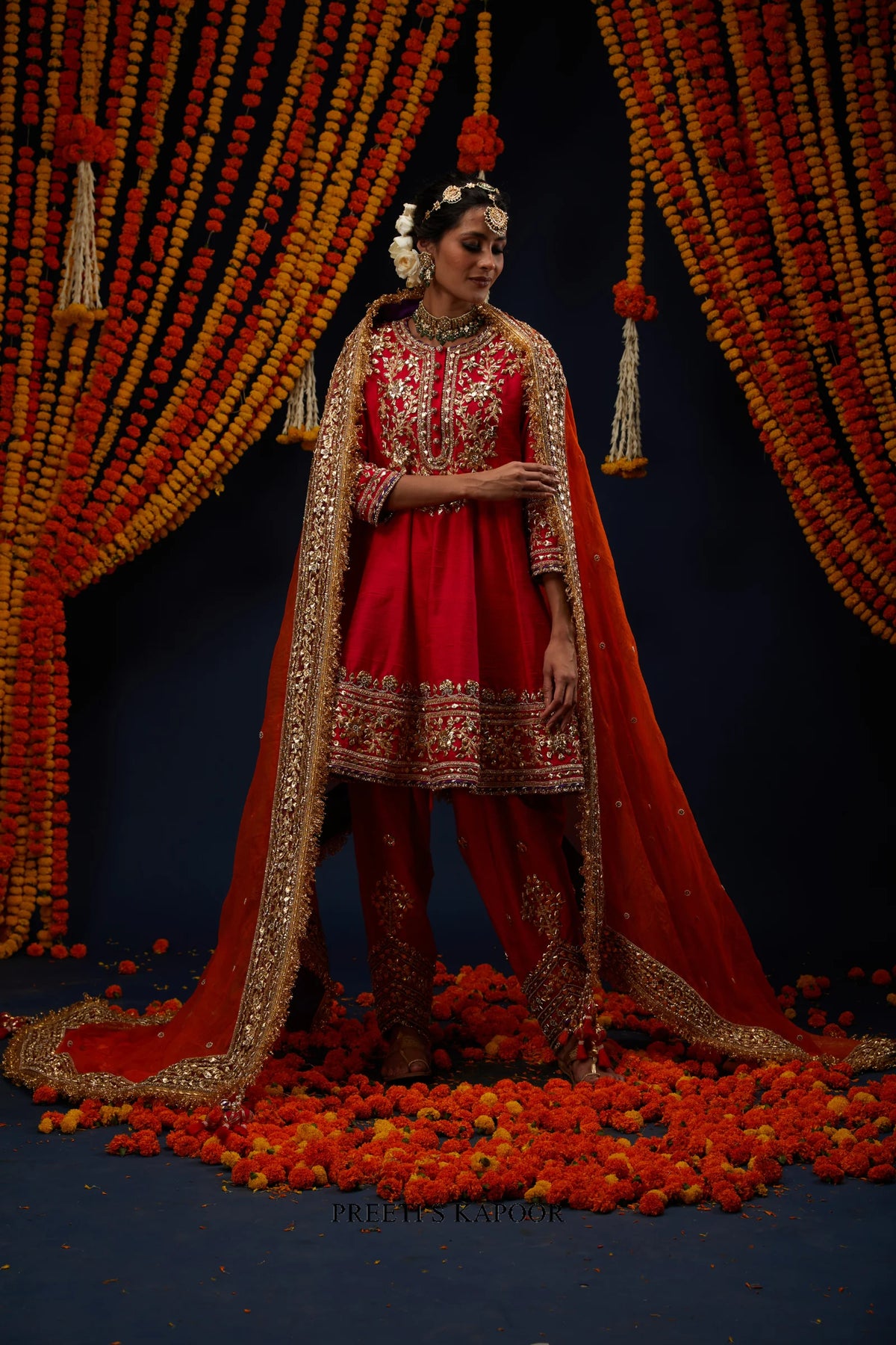 Woman wearing Red raw silk kurta salwar with Rust Orange dupatta – Preeti S Kapoor